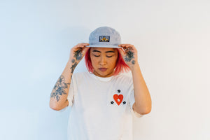 DEEDS NOT WORDS 5-PANEL HAT