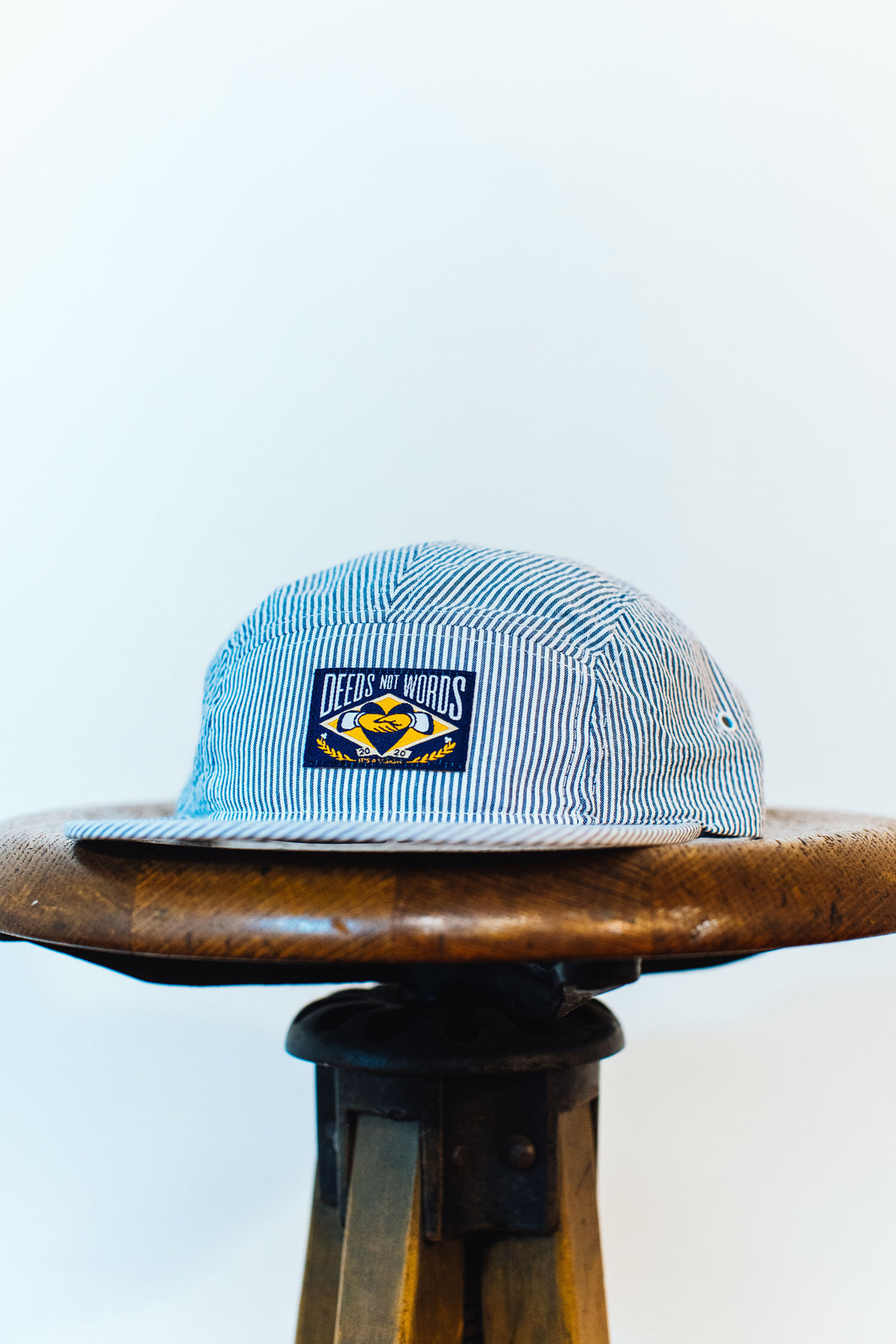 DEEDS NOT WORDS 5-PANEL HAT